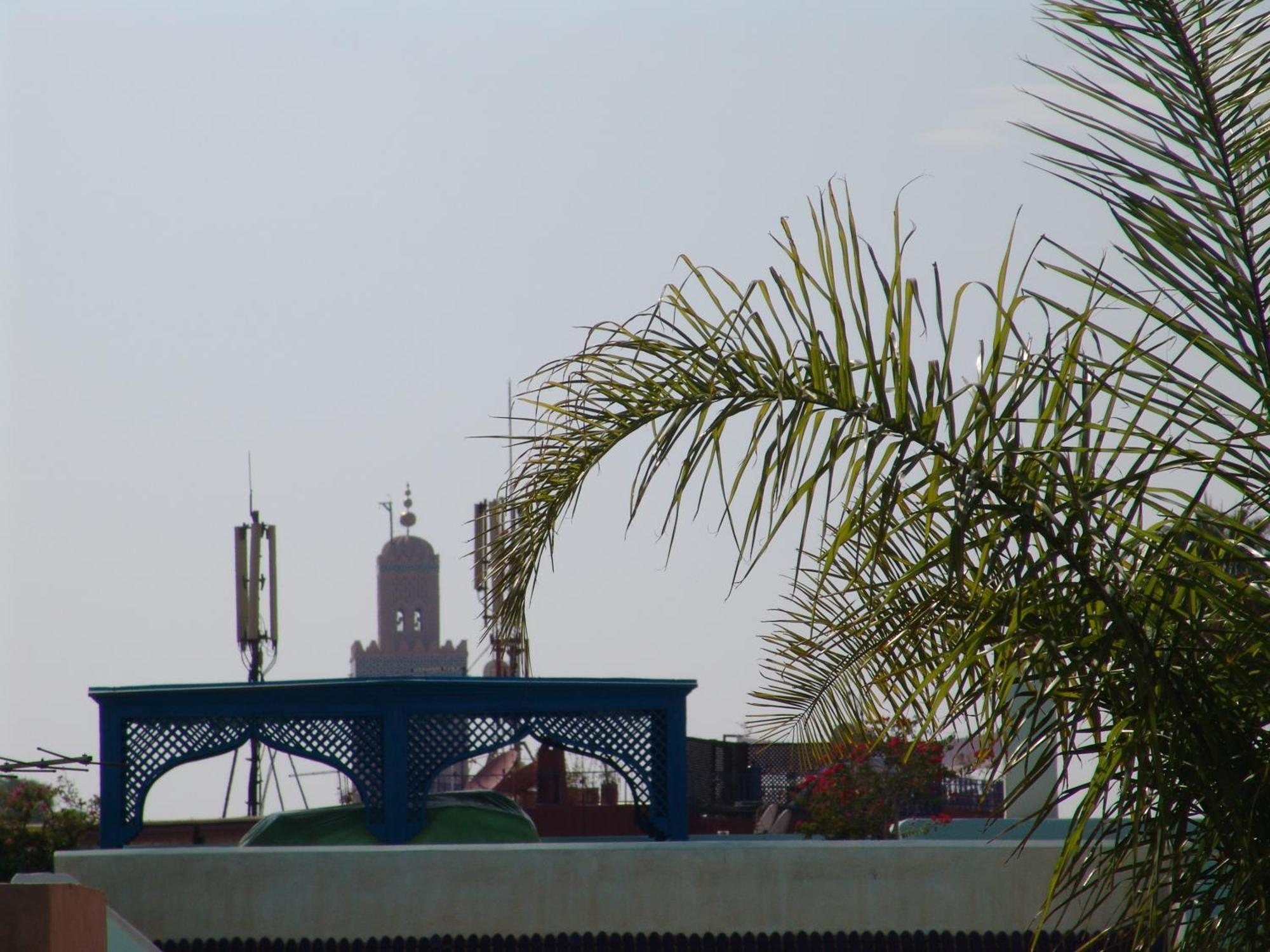 Riad Les Nuits De Marrakech Marrakesh Exterior photo The mosque from the roof of a nearby house