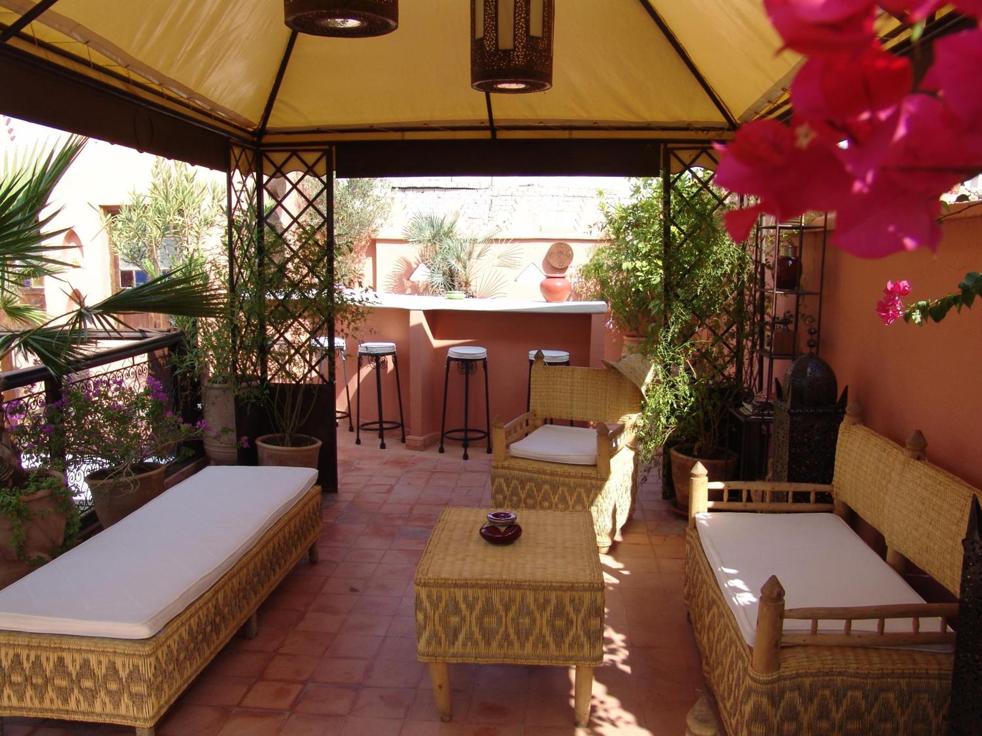 Riad Les Nuits De Marrakech Marrakesh Exterior photo A rooftop terrace in Marrakech